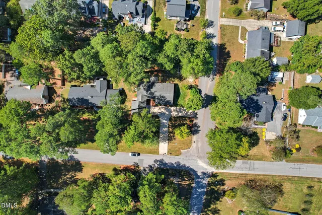 an aerial view of residential houses with outdoor space