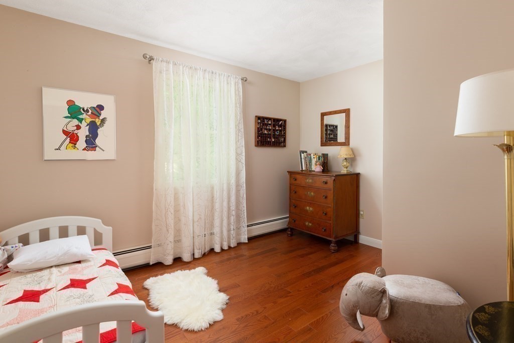 64 Rattlesnake Hill Road Andover, MA 01810 - Photo 18 of 23 a bedroom with a bed and furniture