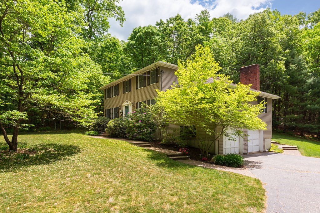 64 Rattlesnake Hill Road Andover, MA 01810 - Photo 23 of 23 a yellow house with trees in front of it