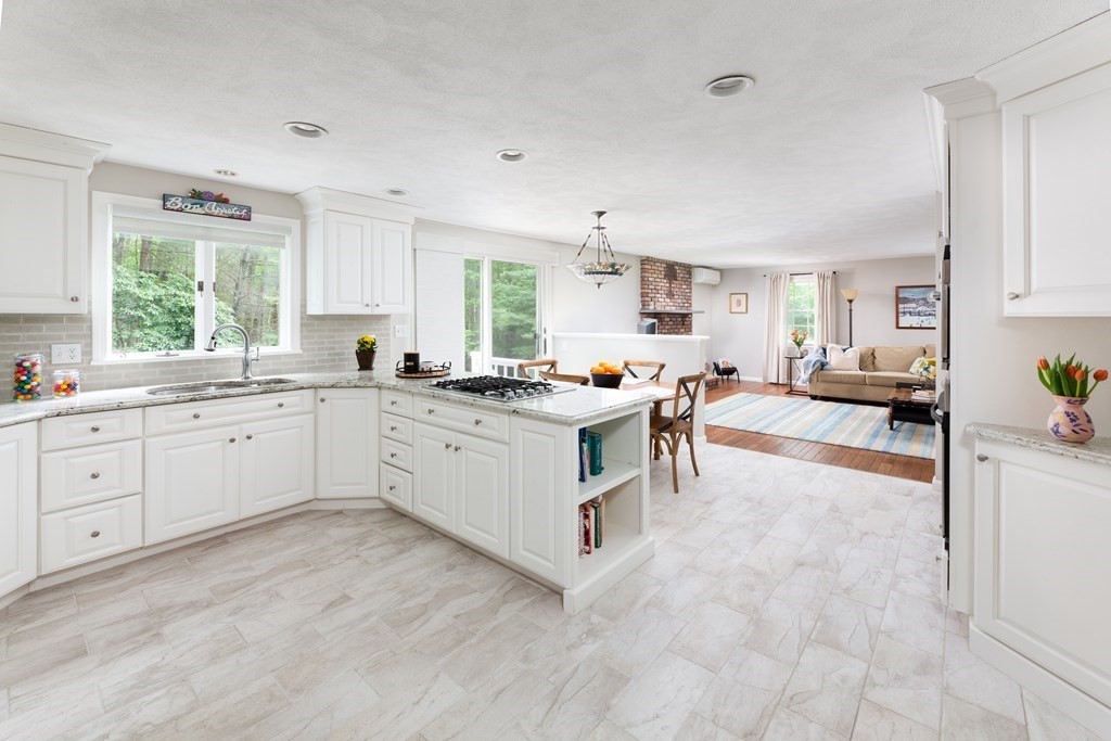 64 Rattlesnake Hill Road Andover, MA 01810 - Photo 3 of 23 a kitchen with white cabinets and white appliances