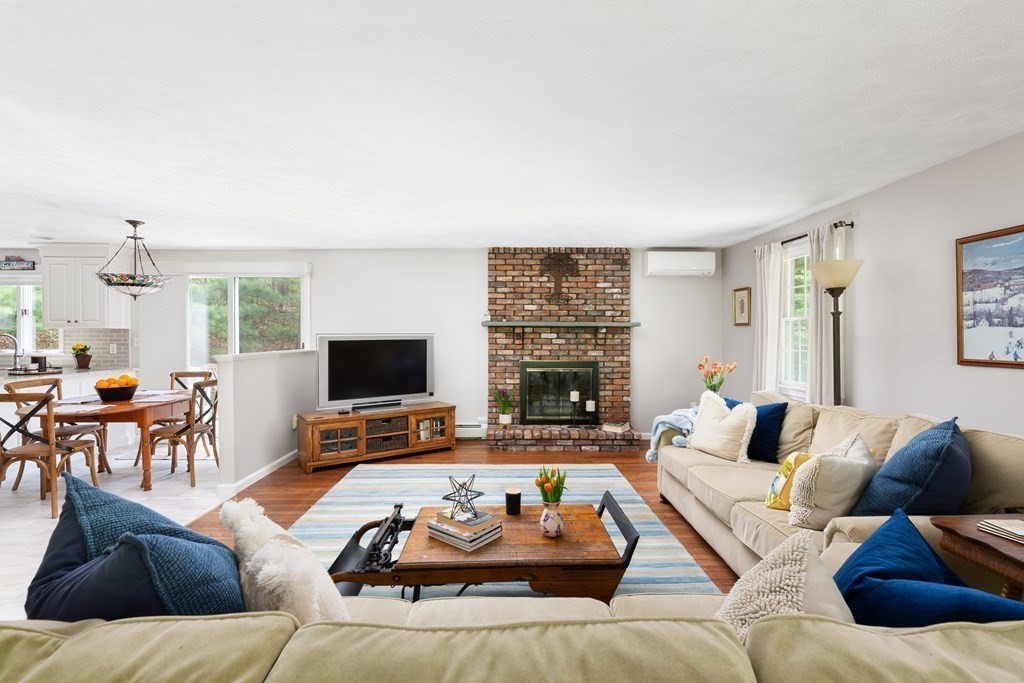 64 Rattlesnake Hill Road Andover, MA 01810 - Photo 5 of 23 a living room with furniture and a fireplace