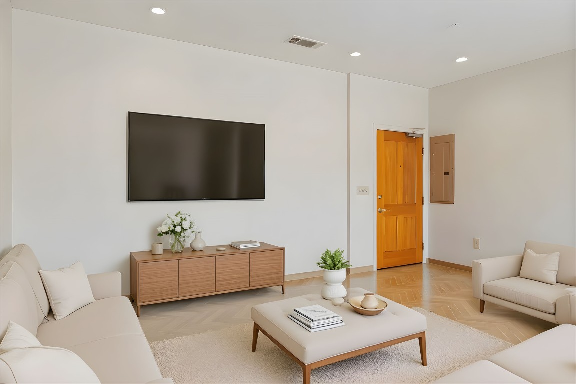 1600 Barton Springs Road, Unit 5301 Austin, TX 78704 - Photo 3 of 30 a living room with furniture and a flat screen tv