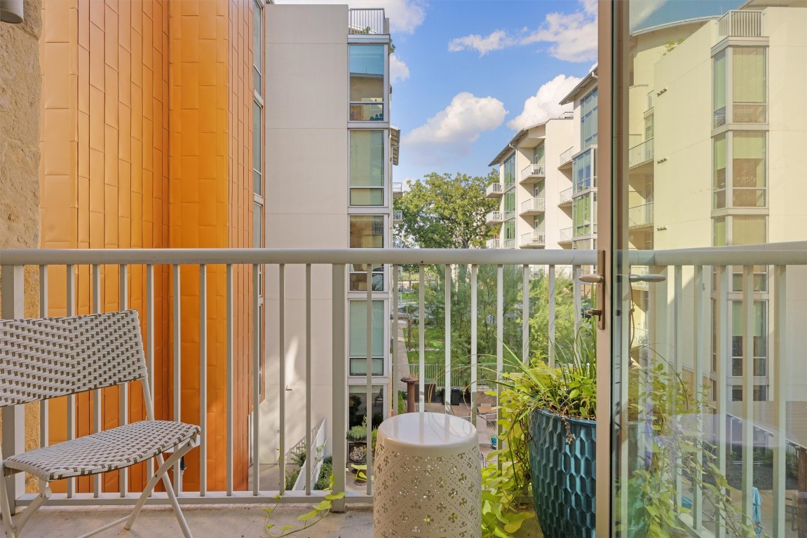 1600 Barton Springs Road, Unit 5301 Austin, TX 78704 - Photo 7 of 30 a view of a balcony with wooden floor