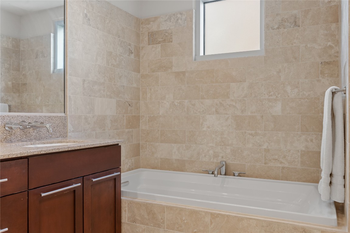 1600 Barton Springs Road, Unit 5301 Austin, TX 78704 - Photo 10 of 30 a bathroom with a bathtub and a shower