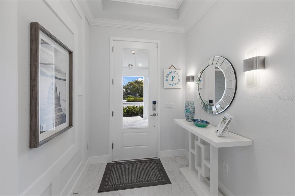 5557 Long Shore Loop Sarasota, FL 34238 - Photo 12 of 90 a view of a entryway door with wooden floor