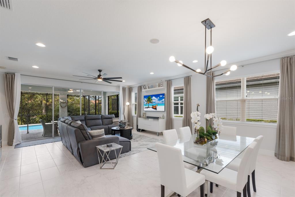 5557 Long Shore Loop Sarasota, FL 34238 - Photo 14 of 90 a living room with furniture and a chandelier