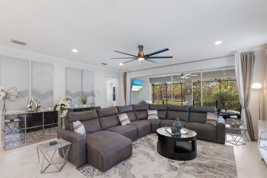 5557 Long Shore Loop Sarasota, FL 34238 - Photo 15 of 90 a living room with furniture and a large window