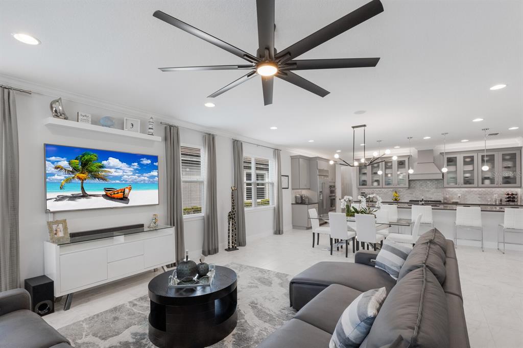 5557 Long Shore Loop Sarasota, FL 34238 - Photo 16 of 90 a living room with furniture and a flat screen tv