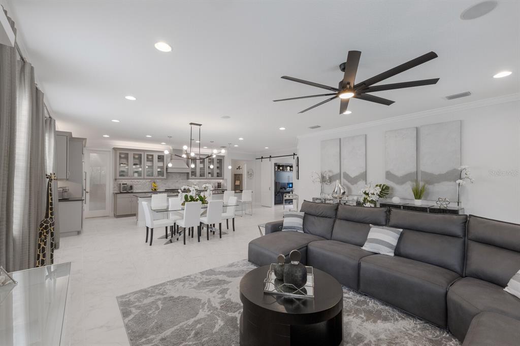 5557 Long Shore Loop Sarasota, FL 34238 - Photo 17 of 90 a living room with furniture and a view of kitchen