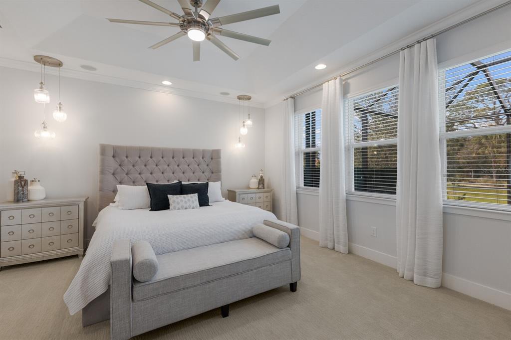 5557 Long Shore Loop Sarasota, FL 34238 - Photo 22 of 90 a bed room with a bed and a window