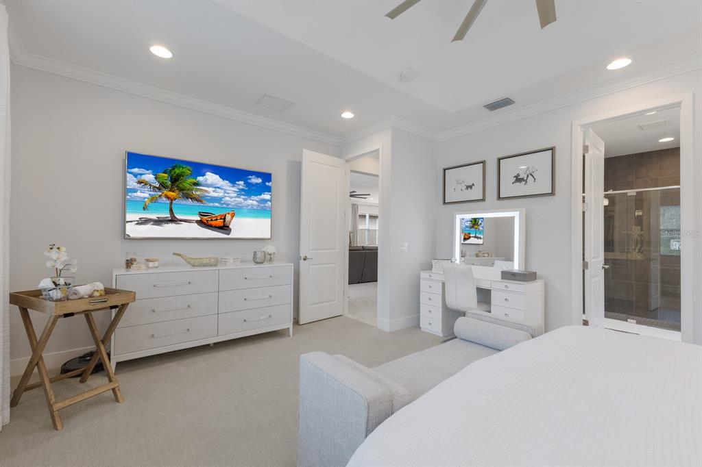 5557 Long Shore Loop Sarasota, FL 34238 - Photo 23 of 90 a bedroom with a bed and furniture