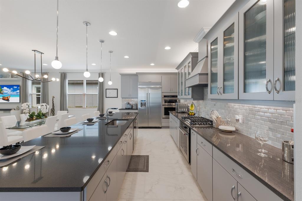 5557 Long Shore Loop Sarasota, FL 34238 - Photo 3 of 90 a large kitchen with stainless steel appliances lots of counter top space