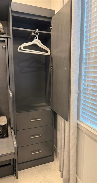 5557 Long Shore Loop Sarasota, FL 34238 - Photo 40 of 90 a bathroom with a sink and washing machine