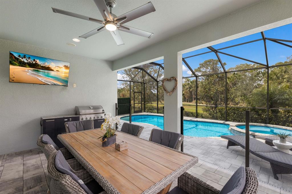 5557 Long Shore Loop Sarasota, FL 34238 - Photo 45 of 90 a view of a dining room with furniture wooden floor and chandelier
