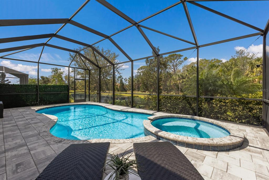 5557 Long Shore Loop Sarasota, FL 34238 - Photo 49 of 90 a view of a backyard with swimming pool