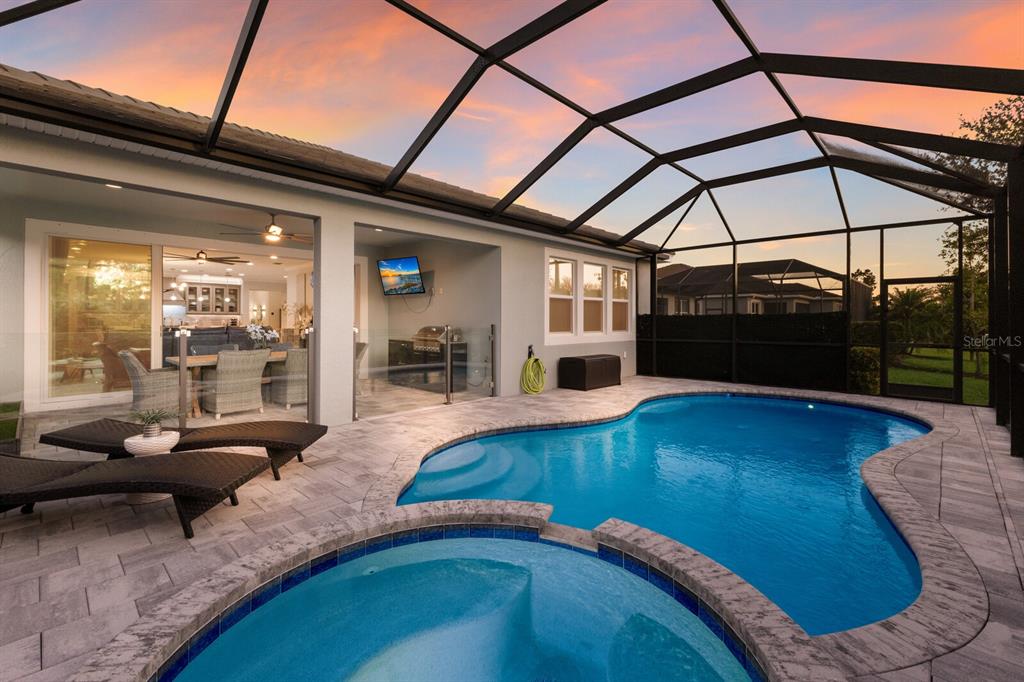 5557 Long Shore Loop Sarasota, FL 34238 - Photo 5 of 90 a view of a living room and livingroom with furniture wooden floor and a rug