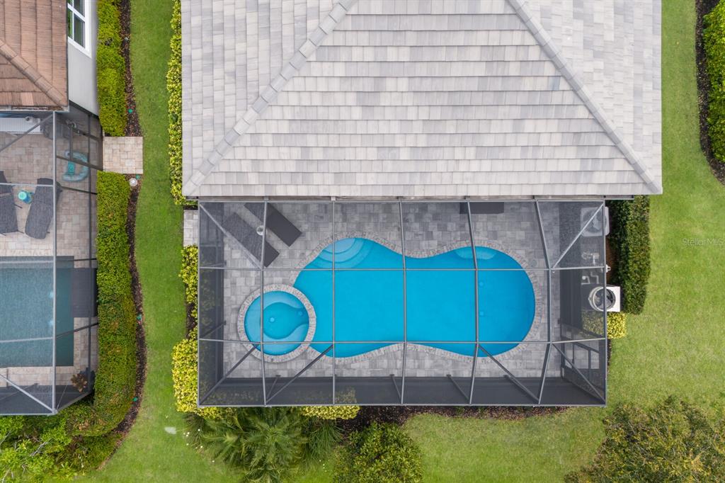 5557 Long Shore Loop Sarasota, FL 34238 - Photo 52 of 90 an aerial view of a house with swimming pool and large trees