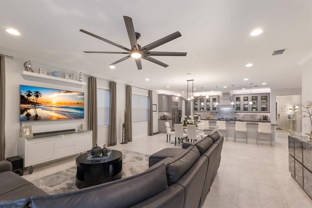 5557 Long Shore Loop Sarasota, FL 34238 - Photo 59 of 90 a living room with furniture kitchen view and a large window