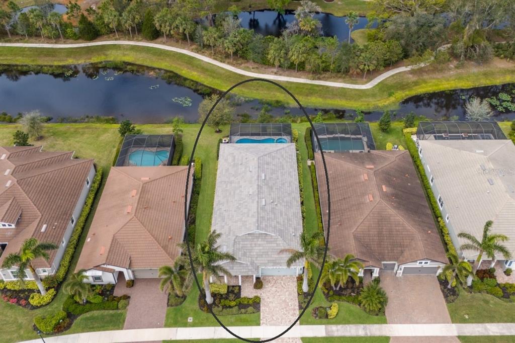 5557 Long Shore Loop Sarasota, FL 34238 - Photo 6 of 90 an aerial view of a house with a yard basket ball court and outdoor seating