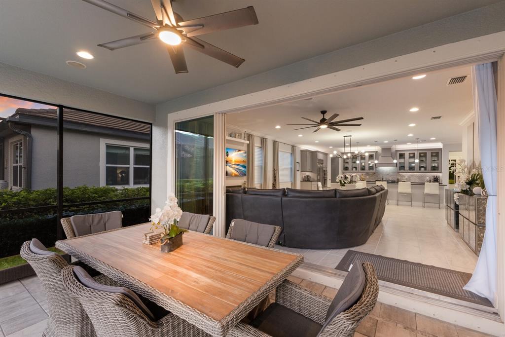 5557 Long Shore Loop Sarasota, FL 34238 - Photo 62 of 90 a view of a dining room with furniture window and wooden floor