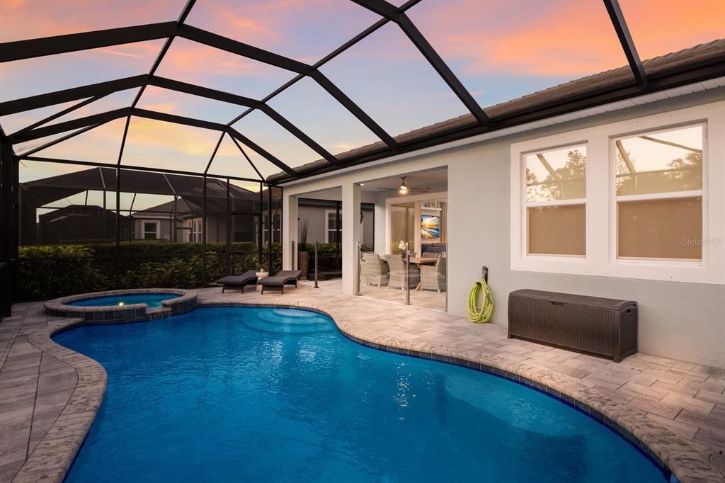 5557 Long Shore Loop Sarasota, FL 34238 - Photo 64 of 90 a view of swimming pool with outdoor seating