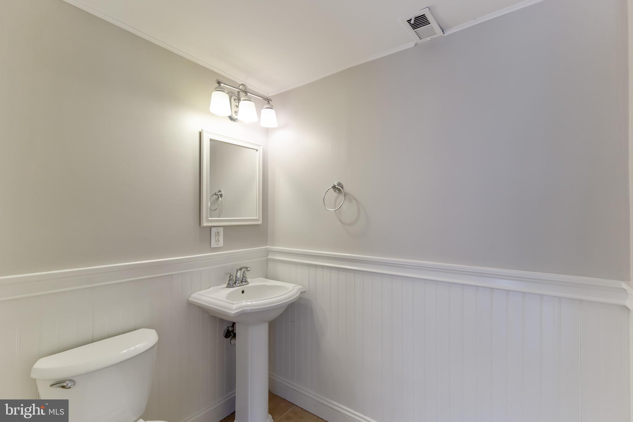 9104 Tulip Grove Road Gaithersburg, MD 20879 - Photo 13 of 27 Main level half bath