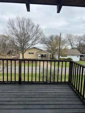 a view of wooden balcony with outdoor space