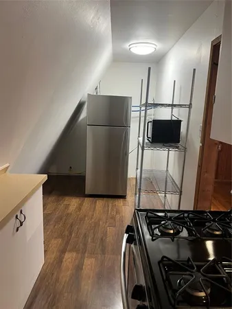 a kitchen with a stove and a refrigerator