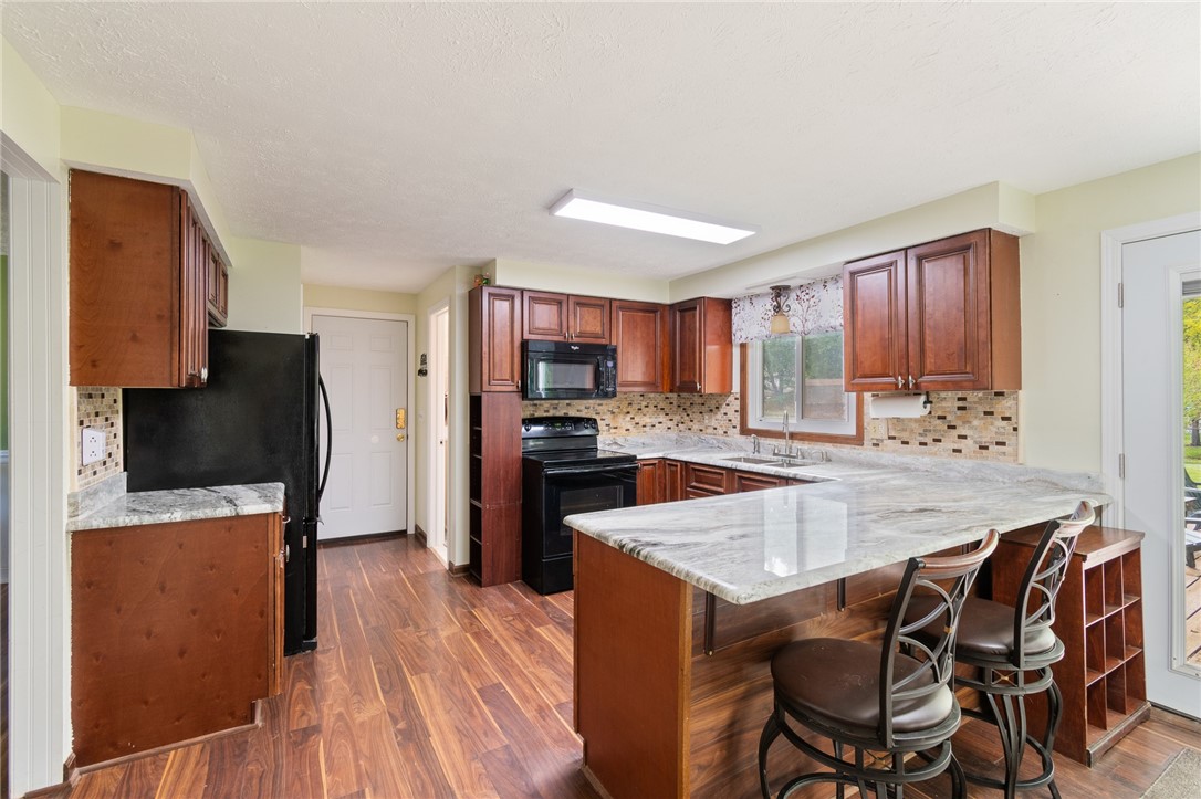 25 Spring Tree Lane Greece, NY 14612 - Photo 9 of 40 Granite counters - tile back splash- updated floor
