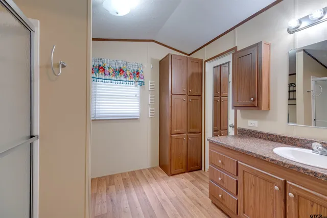 a kitchen with granite countertop a refrigerator and a sink