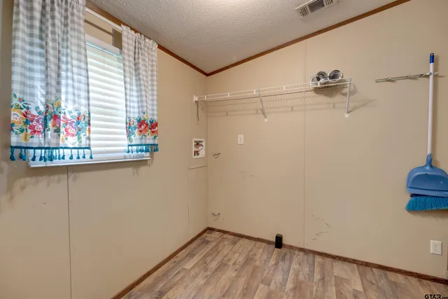 a bathroom with a shower and a window