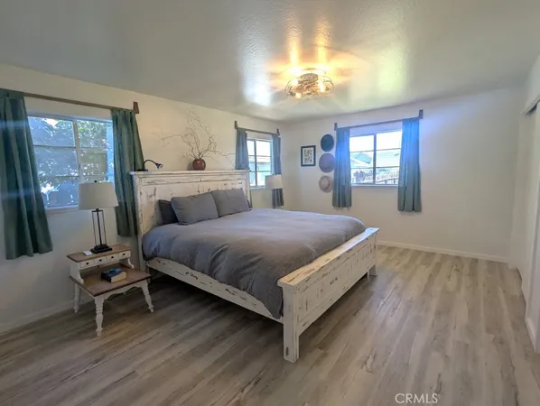 a bathroom with a sink and two mirror