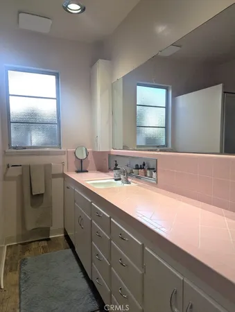 a bathroom with a sink and a mirror