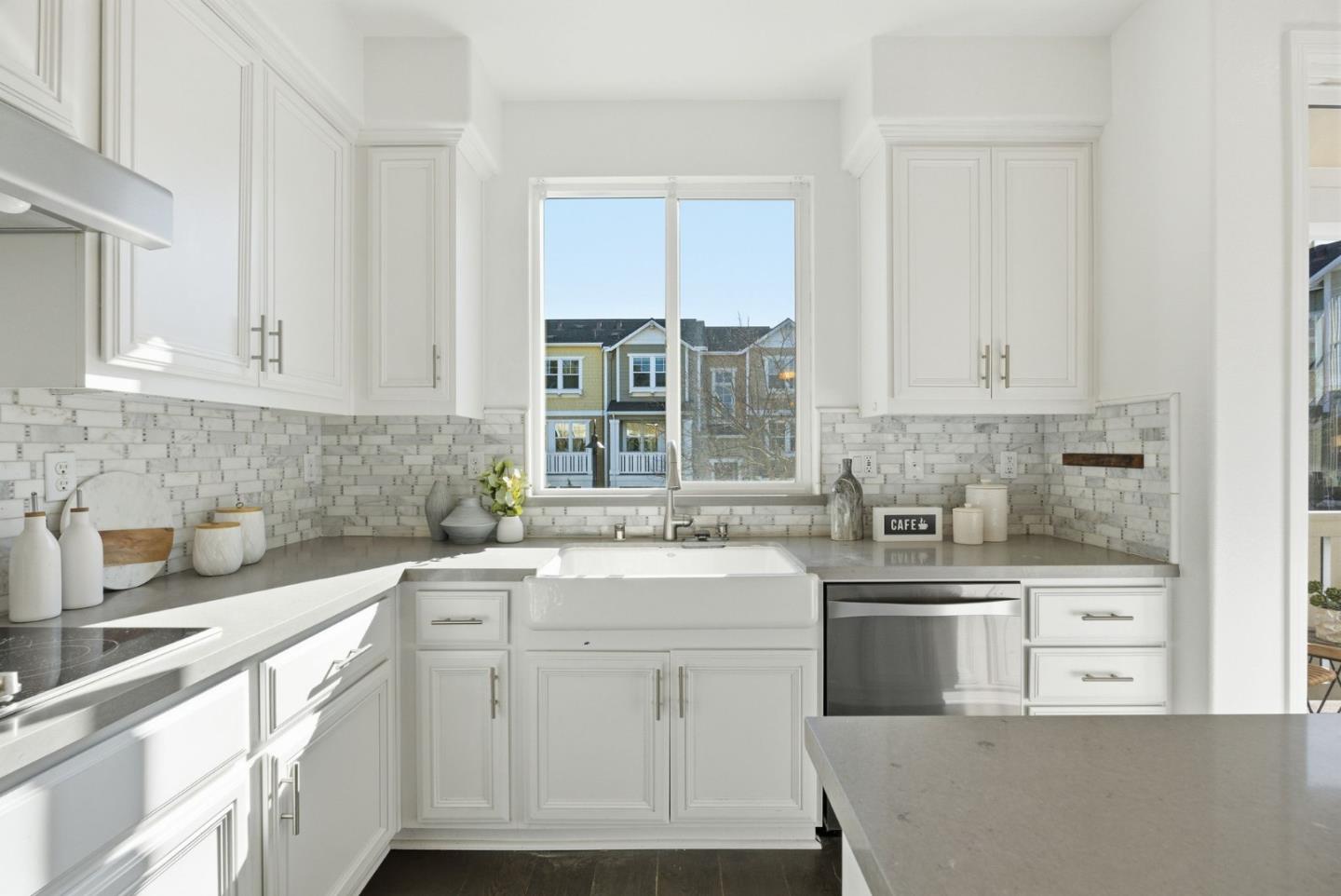 2039 Colony Street Mountain View, CA 94043 - Photo 12 of 43 a kitchen with white cabinets appliances a sink and a window