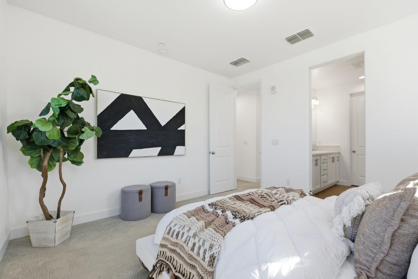 2039 Colony Street Mountain View, CA 94043 - Photo 30 of 43 a bedroom with a bed a couch and potted plant