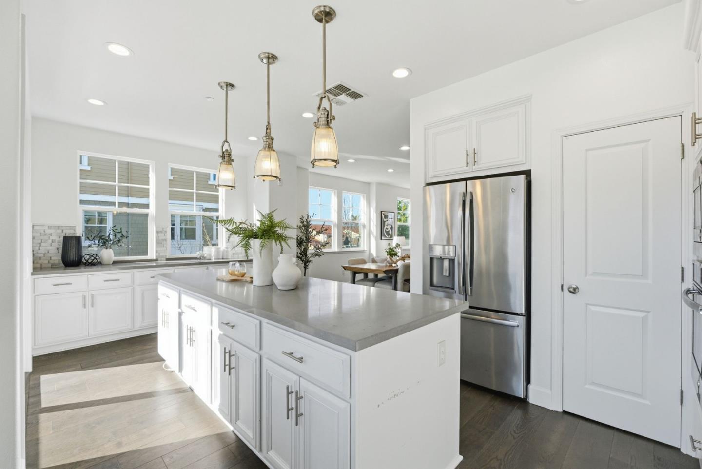 2039 Colony Street Mountain View, CA 94043 - Photo 10 of 43 a kitchen with stainless steel appliances granite countertop a refrigerator a sink dishwasher a oven and a dining table with wooden floor