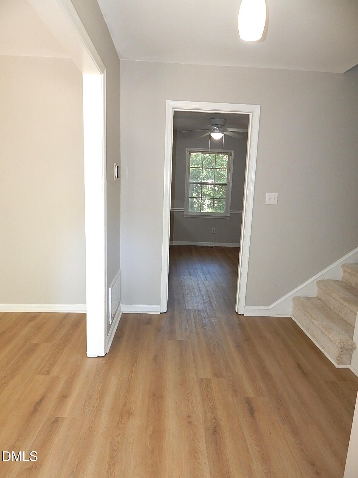 6408 Shadow Court Raleigh, NC 27613 - Photo 12 of 35 an empty room with wooden floor and a window