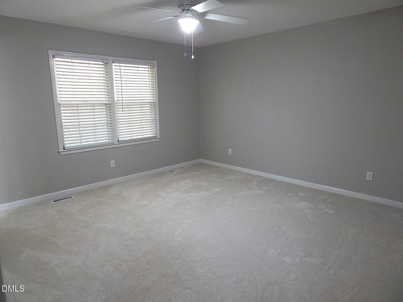 6408 Shadow Court Raleigh, NC 27613 - Photo 20 of 35 an empty room with a window