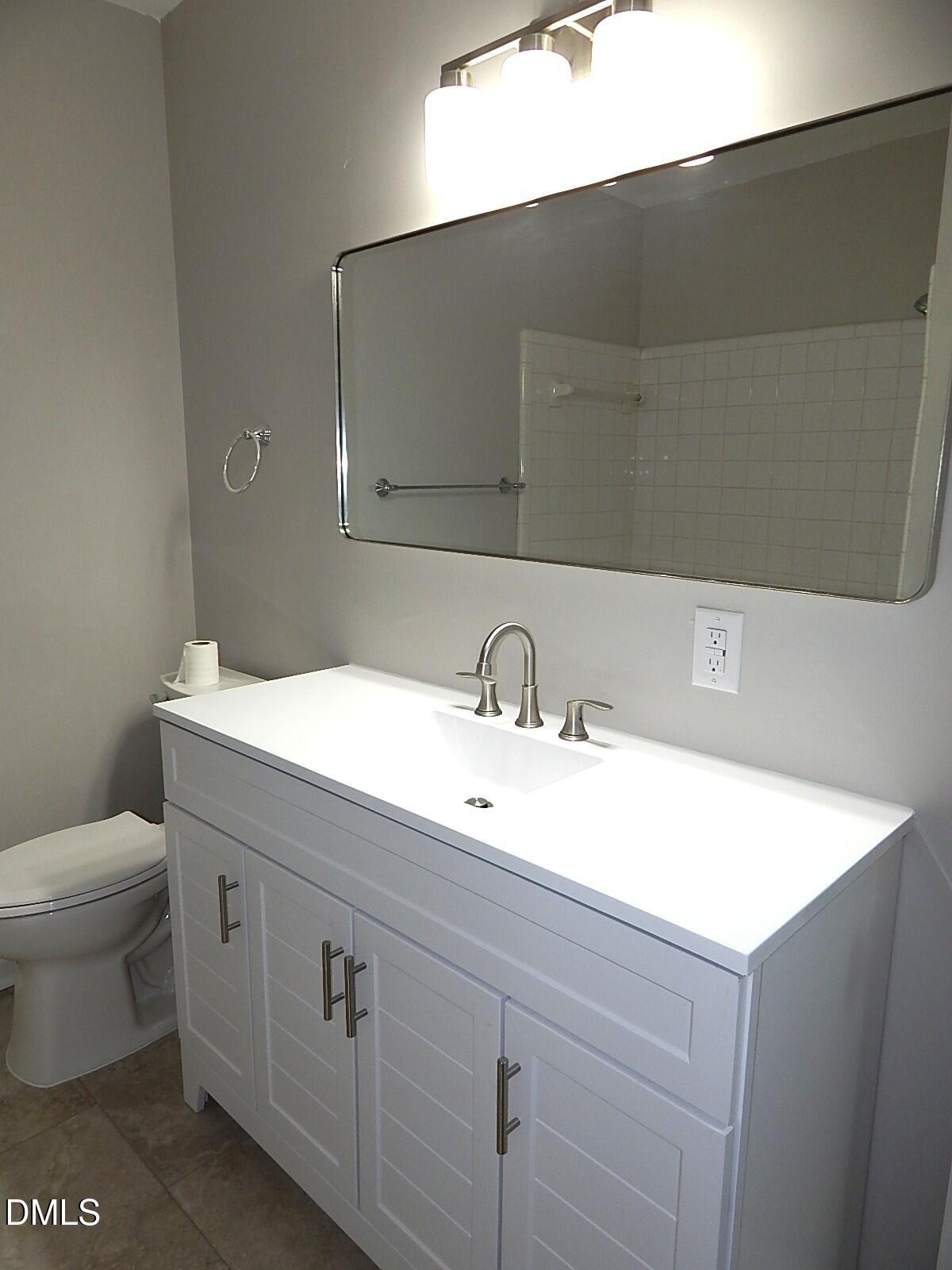6408 Shadow Court Raleigh, NC 27613 - Photo 25 of 35 a bathroom with a sink and a toilet