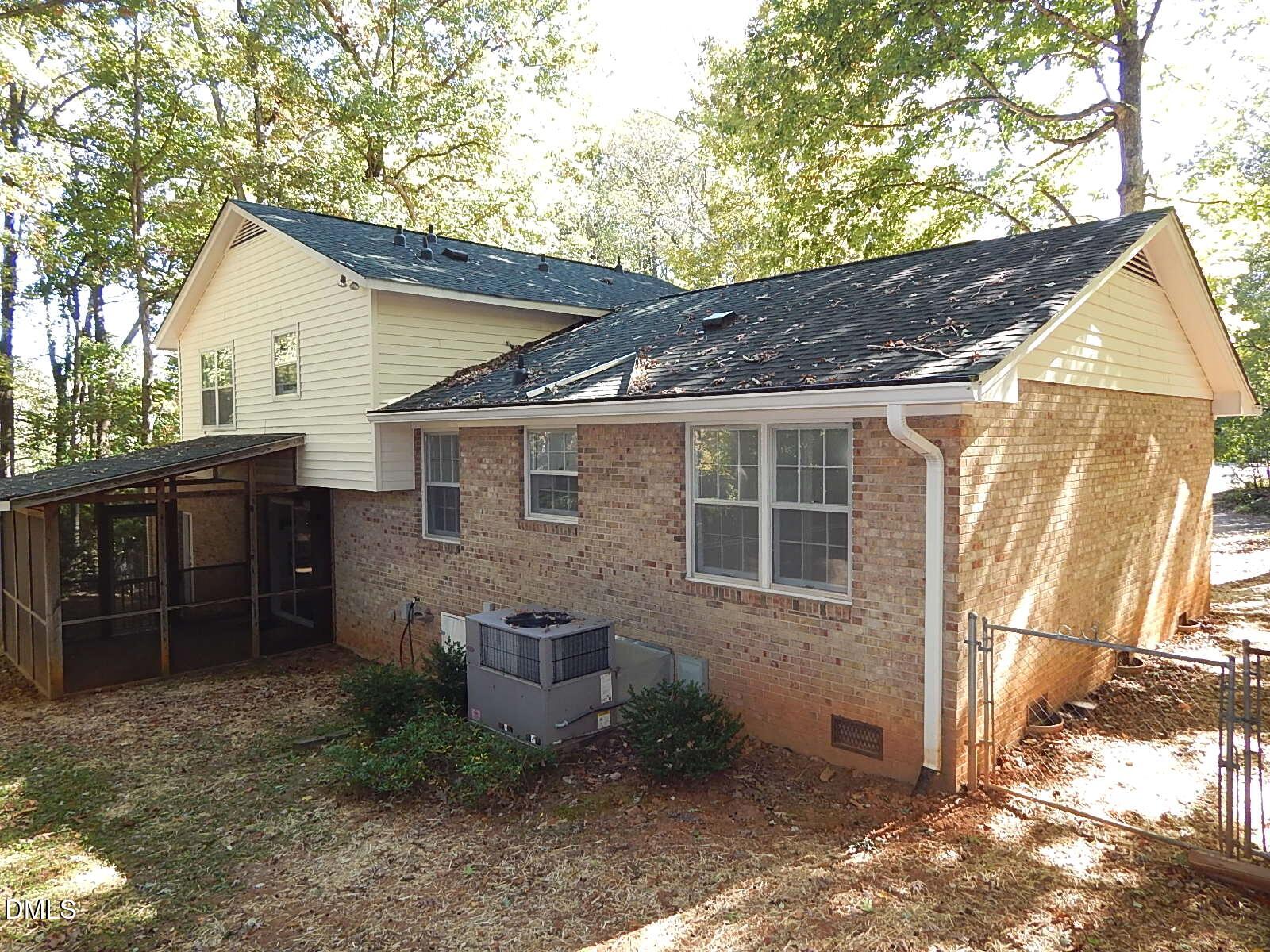 6408 Shadow Court Raleigh, NC 27613 - Photo 5 of 35 a view of a house with a yard and wooden fence