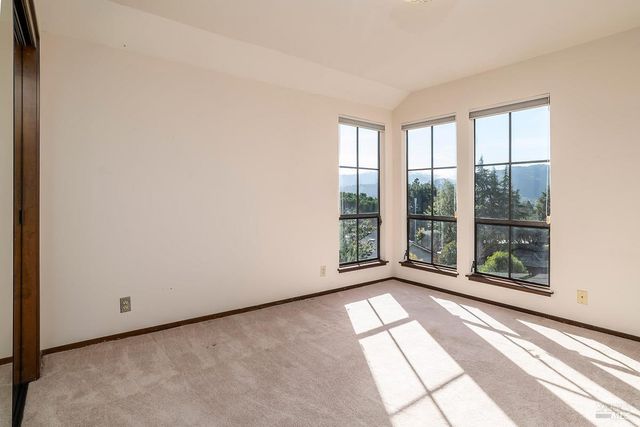 a view of a room with large windows