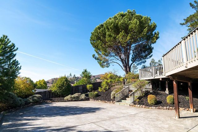 a backyard of a house with lots of green space