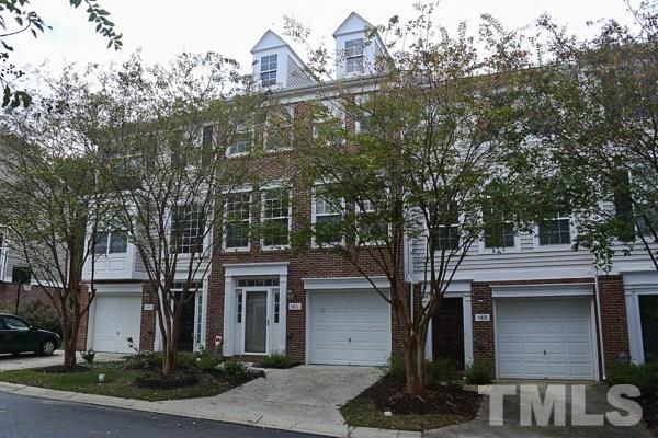 5422 Echo Ridge Road Raleigh, NC 27612 - Photo 1 of 14 a front view of a house with garden