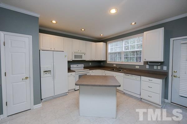 5422 Echo Ridge Road Raleigh, NC 27612 - Photo 5 of 14 a kitchen with a refrigerator and window