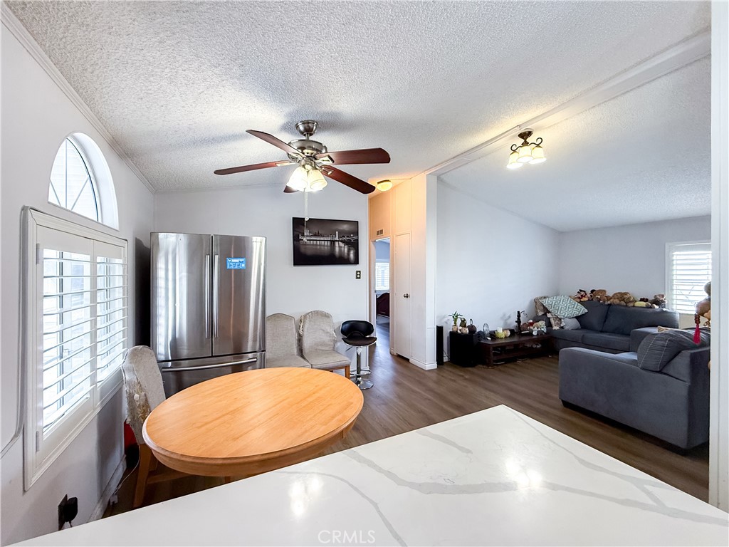 1855 East Riverside, Unit 130 Ontario, CA 91761 - Photo 12 of 62 a view of a livingroom with furniture and a large window