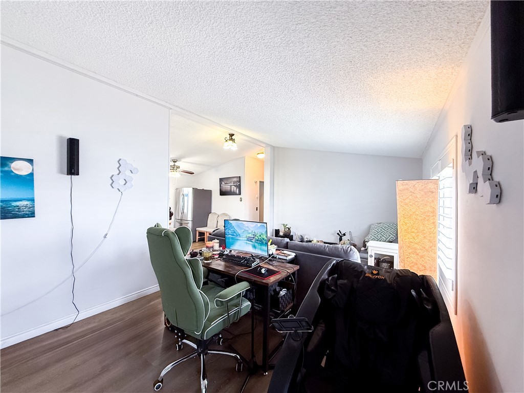 1855 East Riverside, Unit 130 Ontario, CA 91761 - Photo 18 of 62 a view of a dining room with furniture and wooden floor