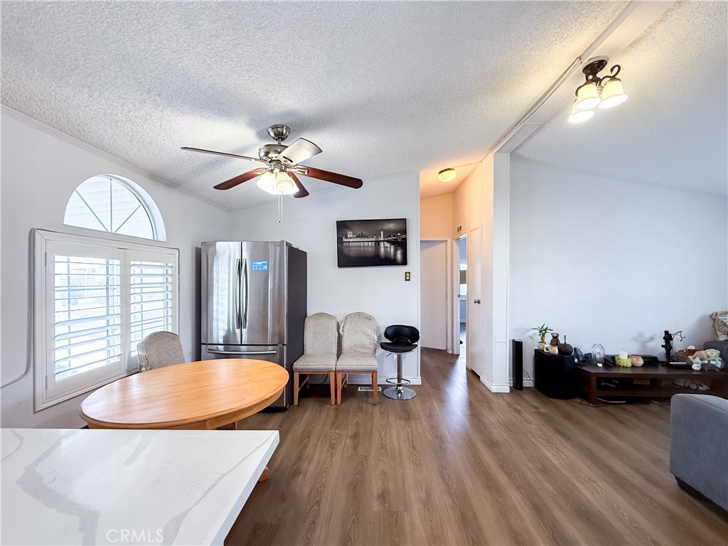 1855 East Riverside, Unit 130 Ontario, CA 91761 - Photo 20 of 62 a view of a livingroom with furniture window and wooden floor