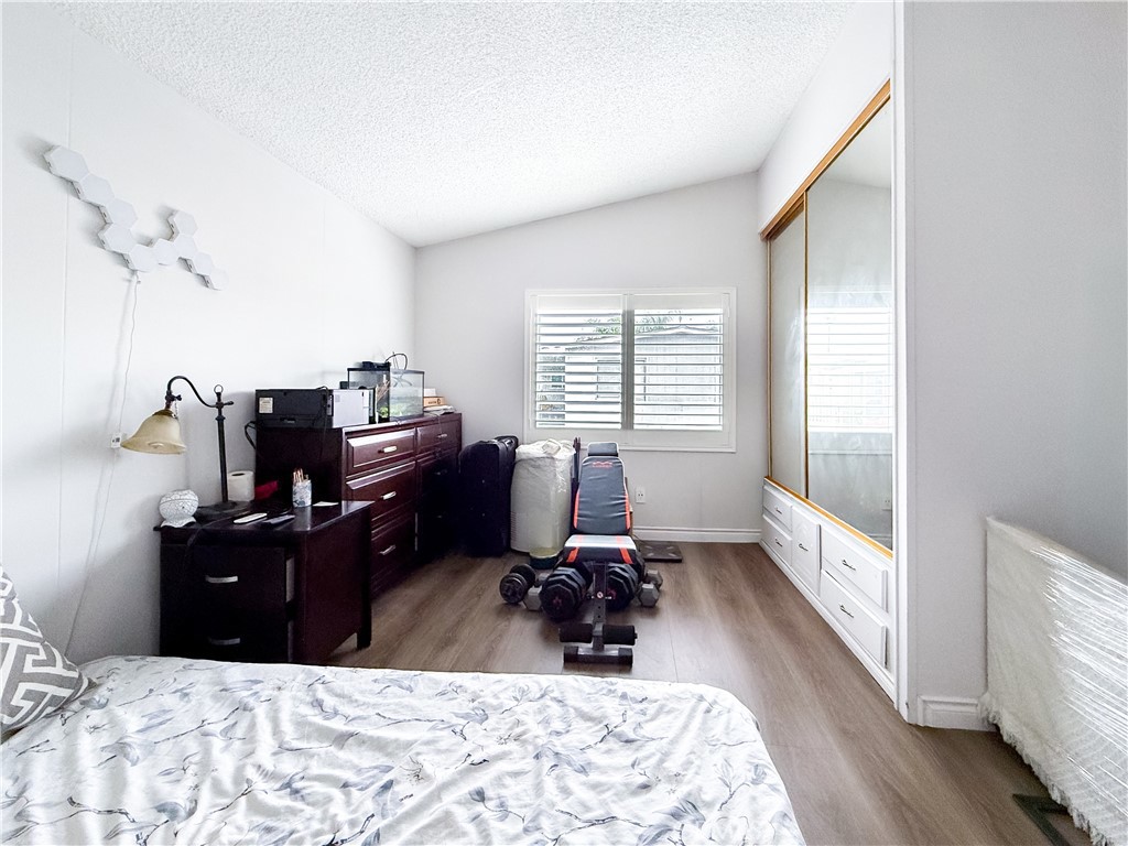 1855 East Riverside, Unit 130 Ontario, CA 91761 - Photo 35 of 62 a room with furniture windows and a flat screen tv