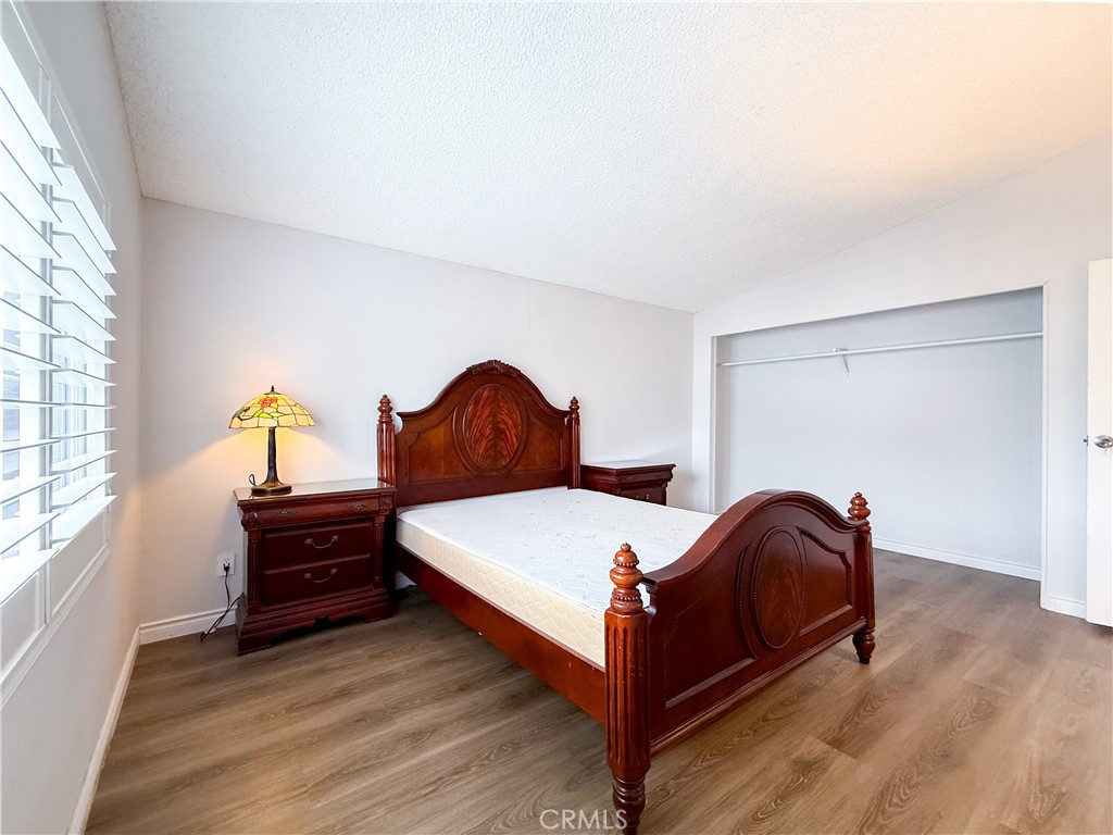 1855 East Riverside, Unit 130 Ontario, CA 91761 - Photo 36 of 62 a bedroom with a bed and window
