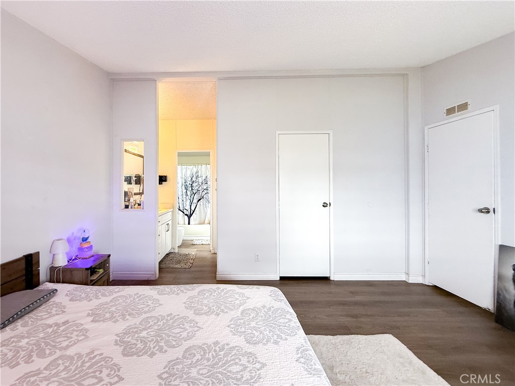 1855 East Riverside, Unit 130 Ontario, CA 91761 - Photo 40 of 62 a bedroom with a bed and a window